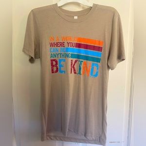 “In a world where you can be anything, be kind.” Women’s tee shirt